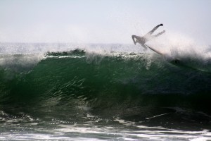 Surfer thrown off board